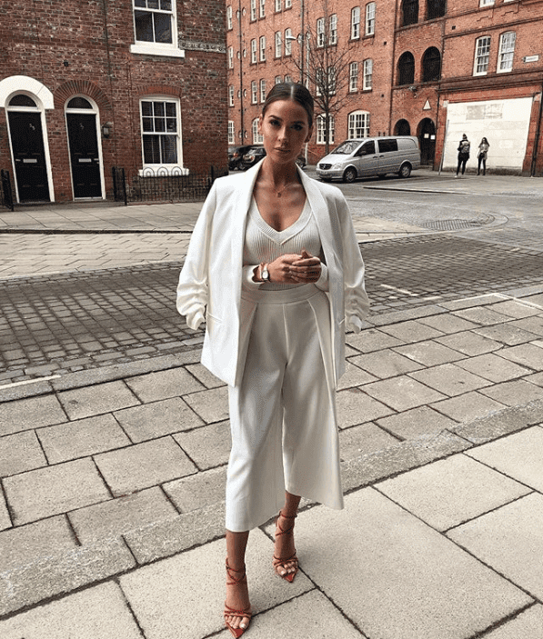 An image of Naomi Genes in a pair of our Kaia red wedding shoes